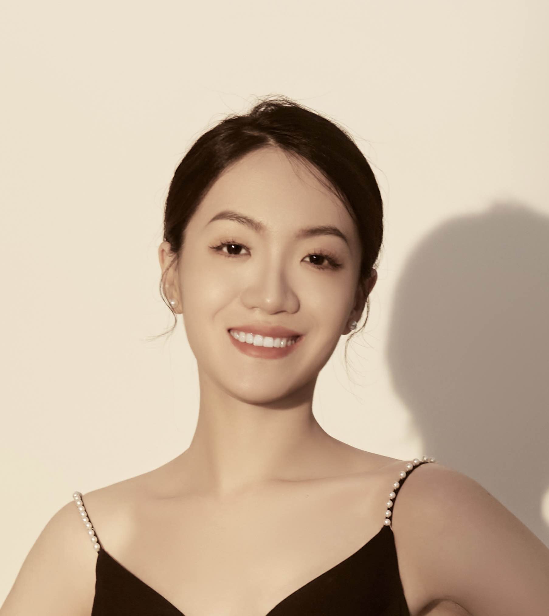 Yuan Dong in a black dress